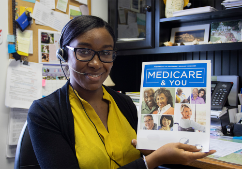 Woman holding Medicare Handbook