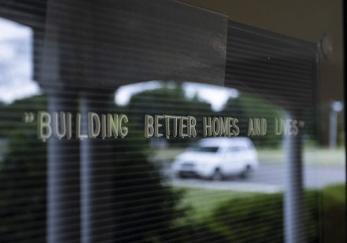 Door sign "building better homes and lives"