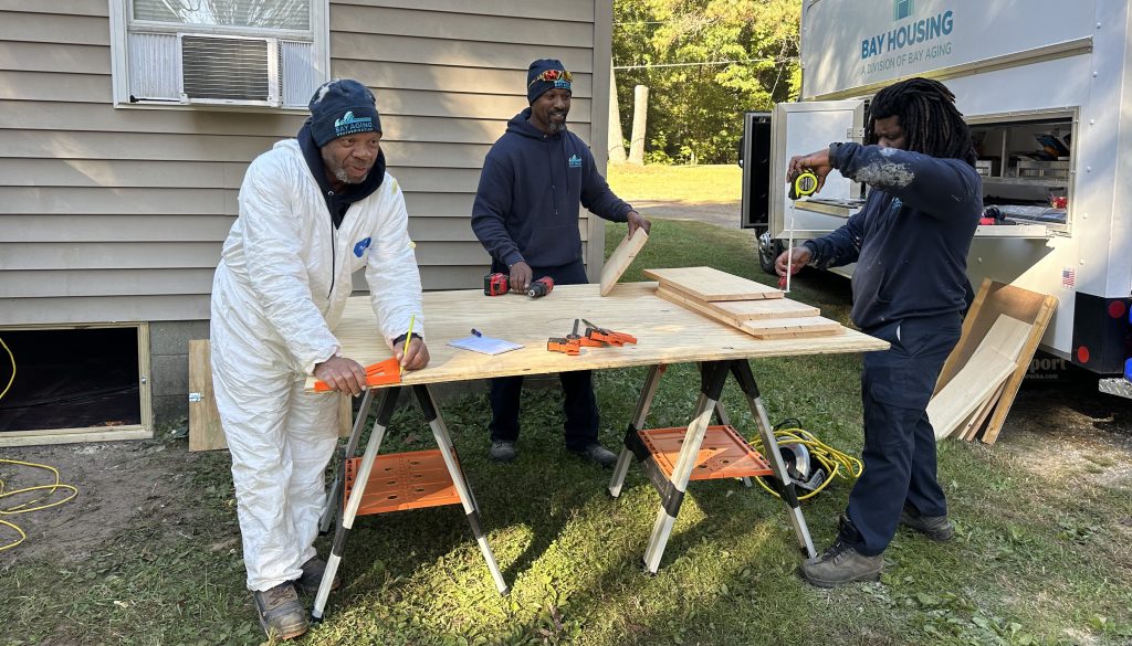 Three men doing construction work