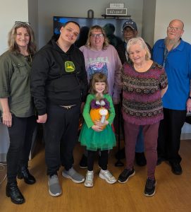 group of people standing celebrating Thanksgiving
