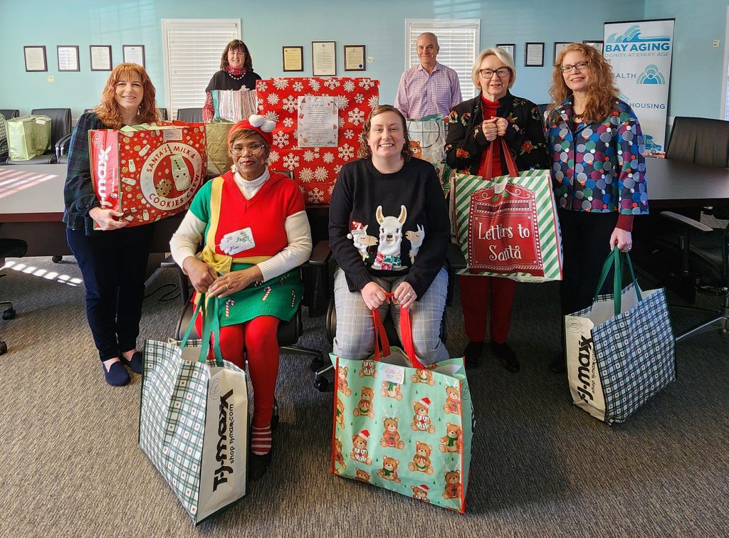group of people with Christmas Presents