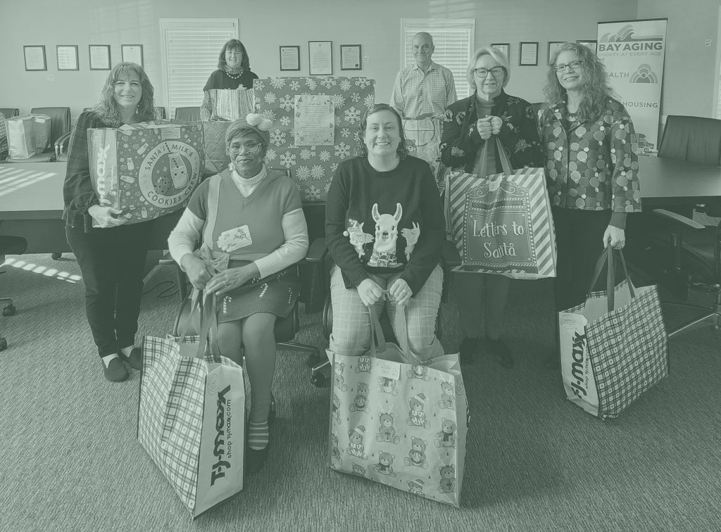 group of people with Christmas Presents